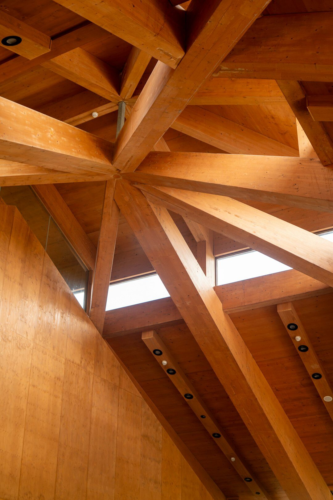 Close-up of oak wood and travertine architectural details with ocean light