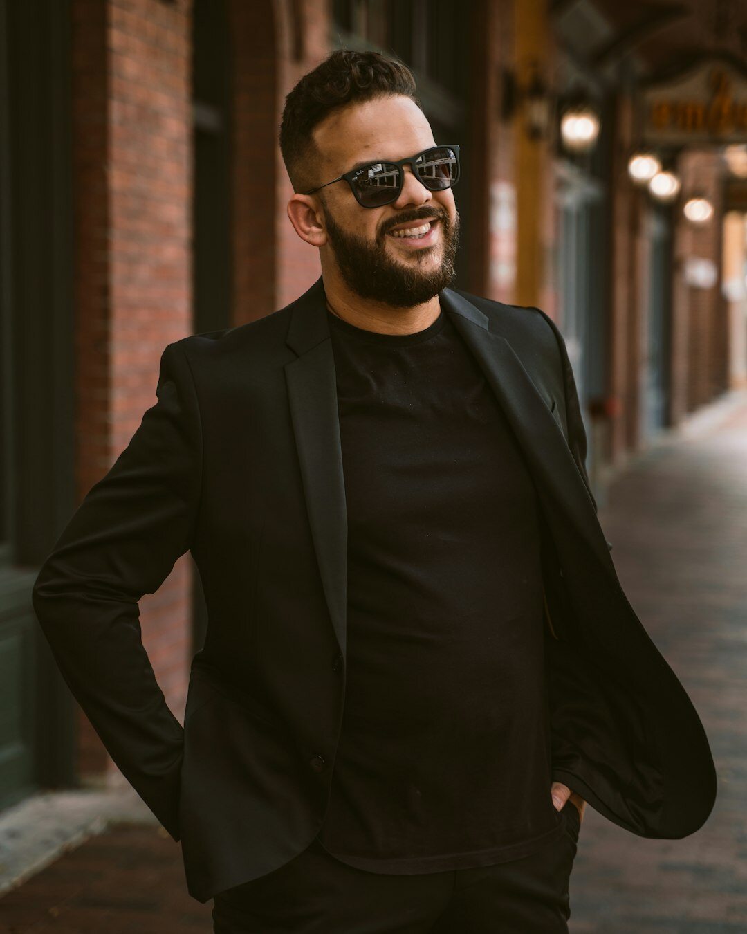 Studio portrait of a Uruguayan real estate agent in his forties wearing a navy blazer