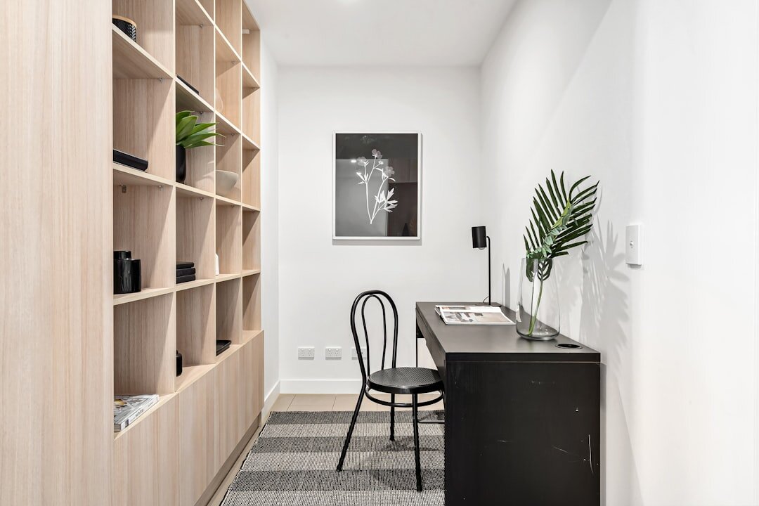 Minimalist boutique real estate office interior with linen and oak furnishings